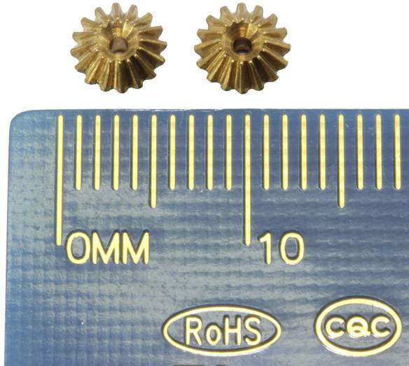 Two small, gold-coloured gears next to a ruler measured in millimetres.