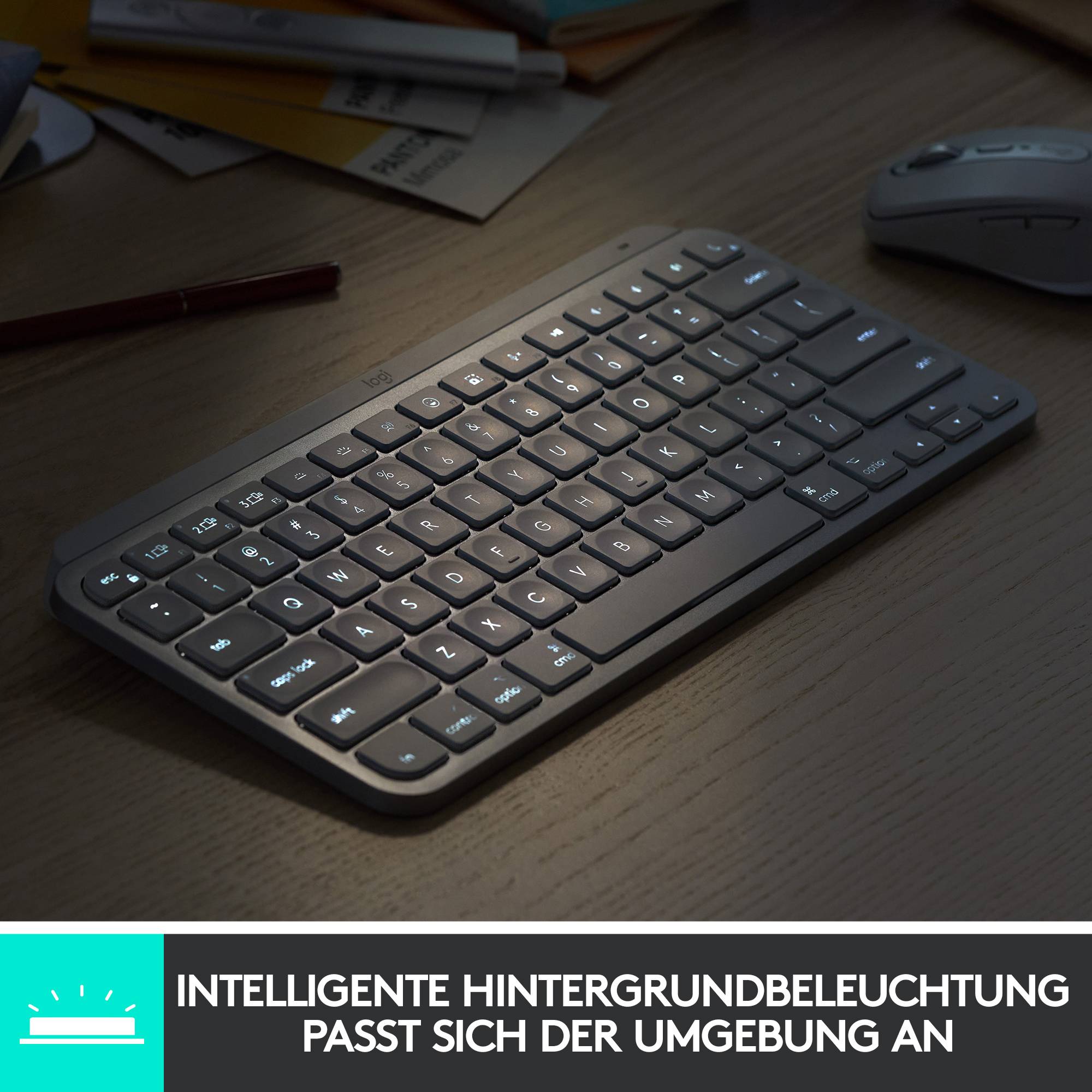 Keyboard with illuminated keys on a desk. Text underneath: 'Intelligent backlighting adapts to the surroundings'.