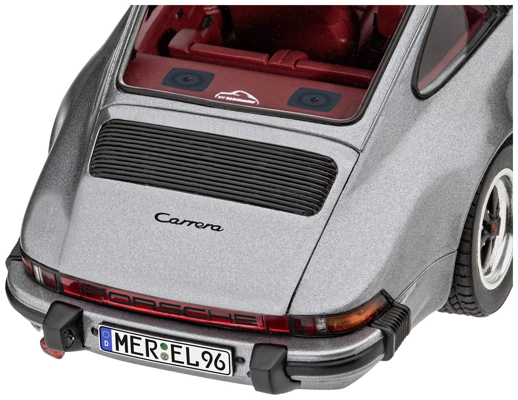 Grey car rear with an open boot lid, classic design. Text on the boot: 'Carrera' and number plate 'MER-EL 96'.