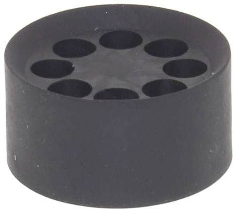 Black, cylindrical plastic block with seven holes on the top surface, likely a holder or base for pens or tools.