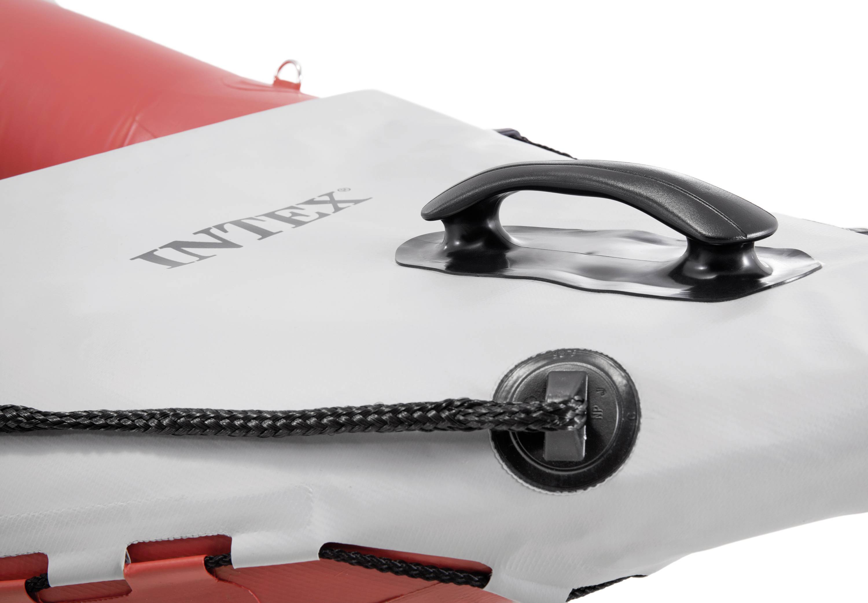 An inflatable, red and white watercraft with a black handle and a cord along the edge. The 'Intex' brand name is visible.