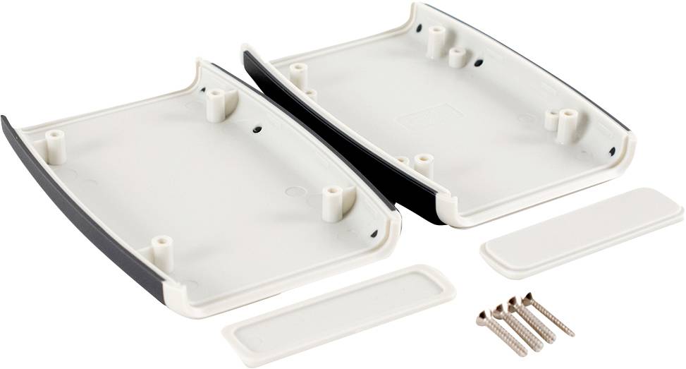 Two identical white plastic housing halves lie open, with four metal screws and two covers beside them.