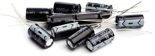 Several black electrolytic capacitors with silver markings and long wire leads, stacked on a white background.