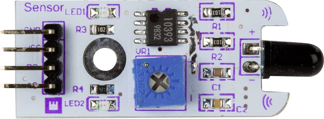 A light scanning sensor module with multiple resistors, LEDs and an IC chip mounted on a small, rectangular circuit board.