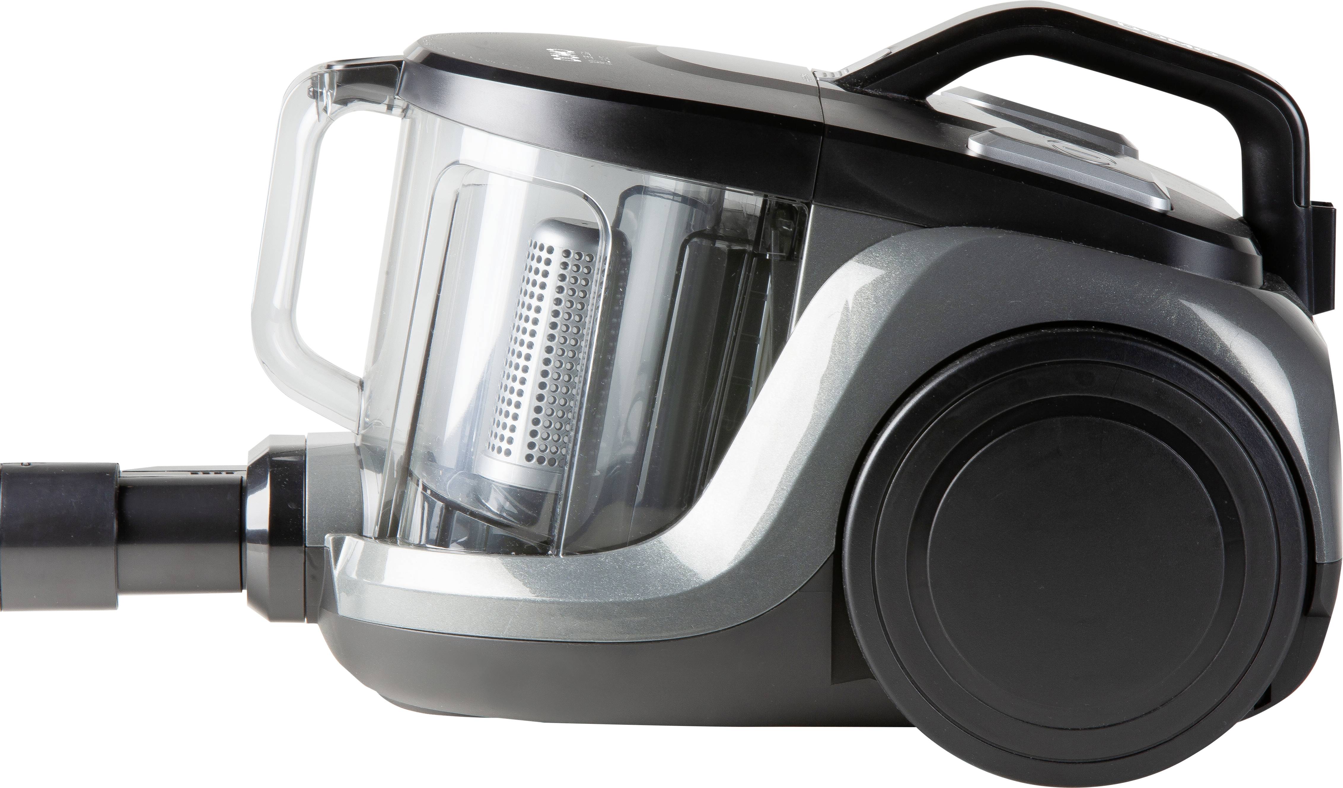 A modern, bagless vacuum cleaner with a transparent dirt container and black casing, shown lying sideways to view.