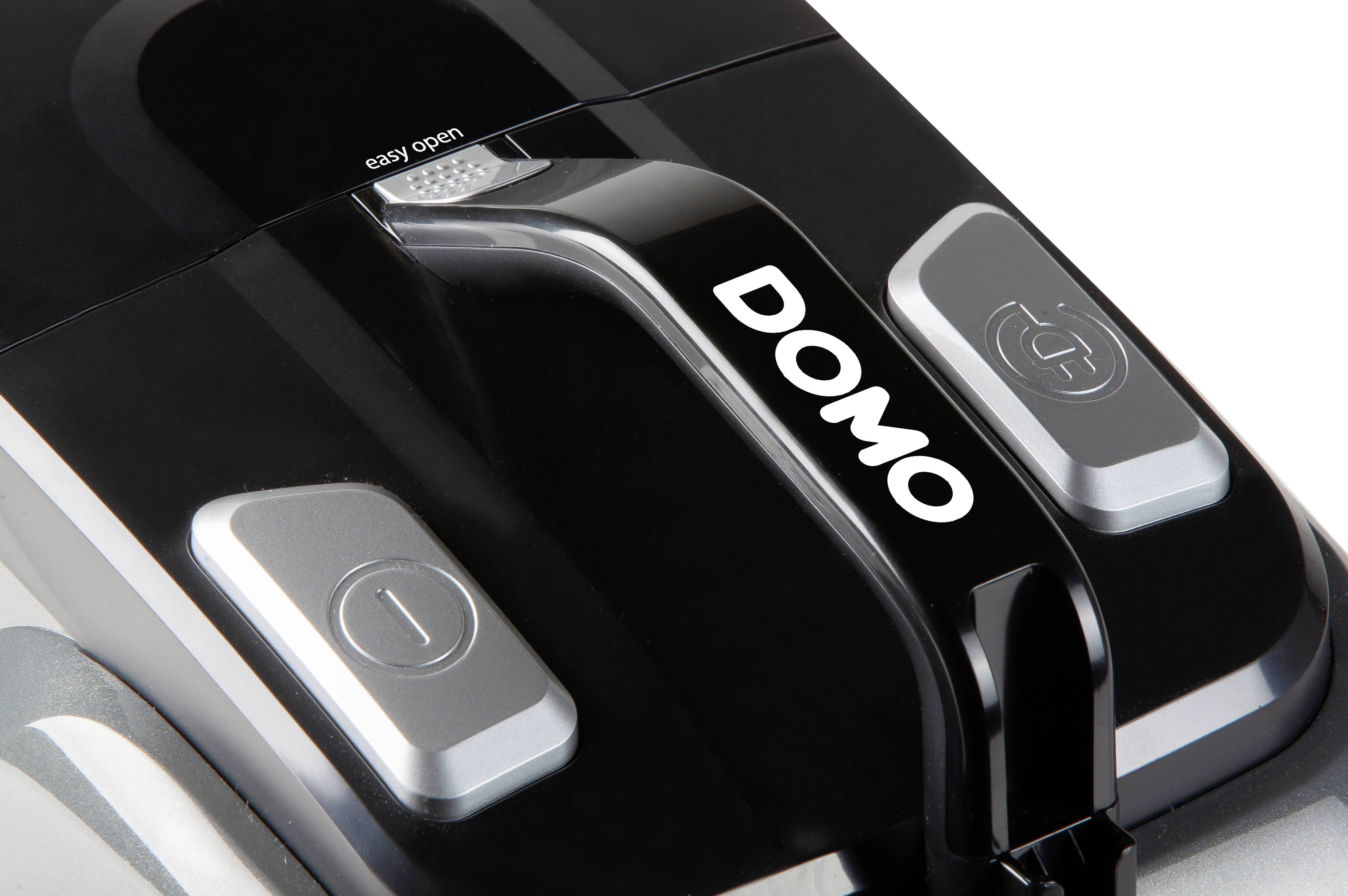 Close-up of a DOMO product with buttons for easy opening and operation.