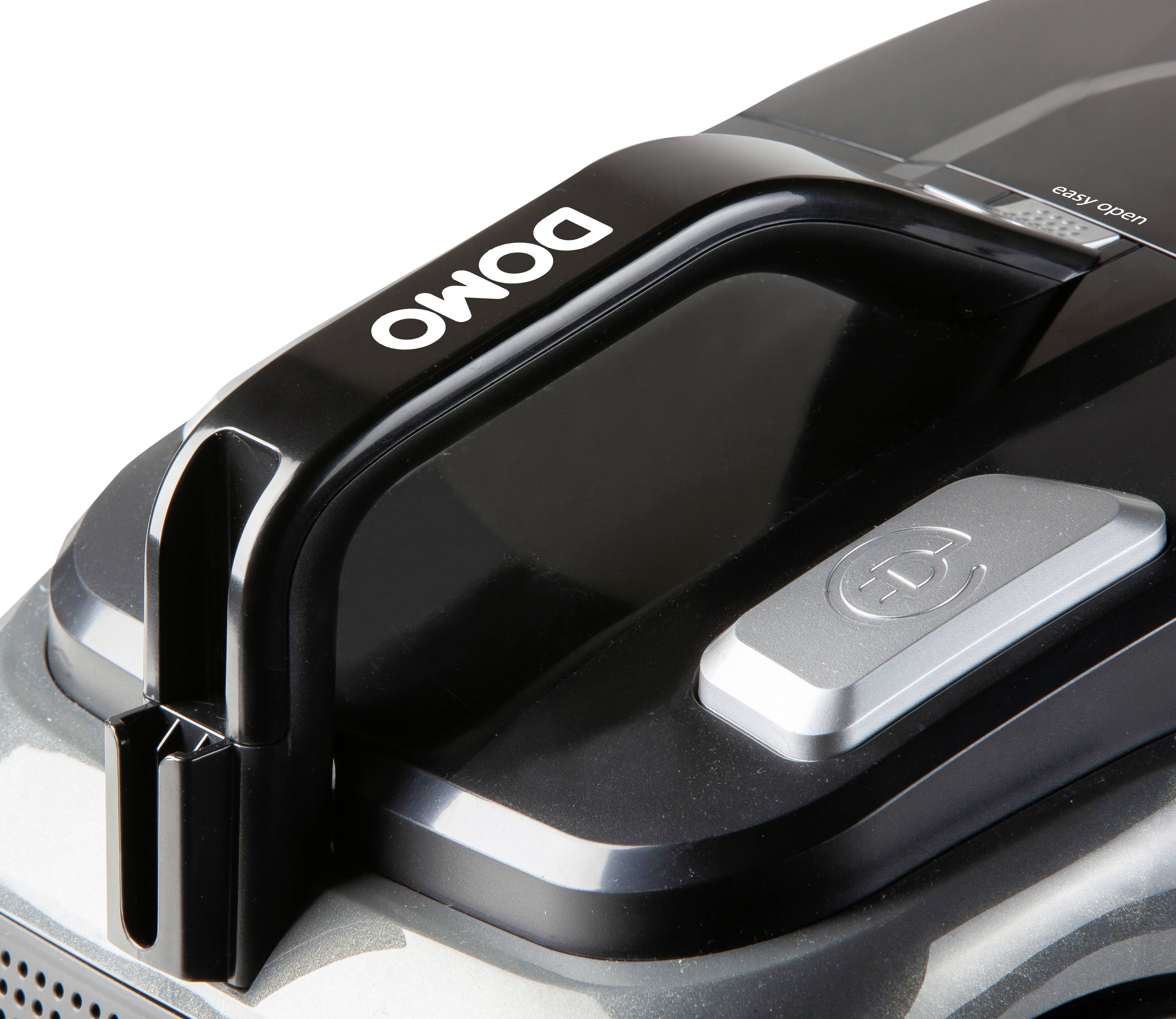 Vacuum cleaner handle with 'Domo' logo, black colour, ergonomic design, close-up.