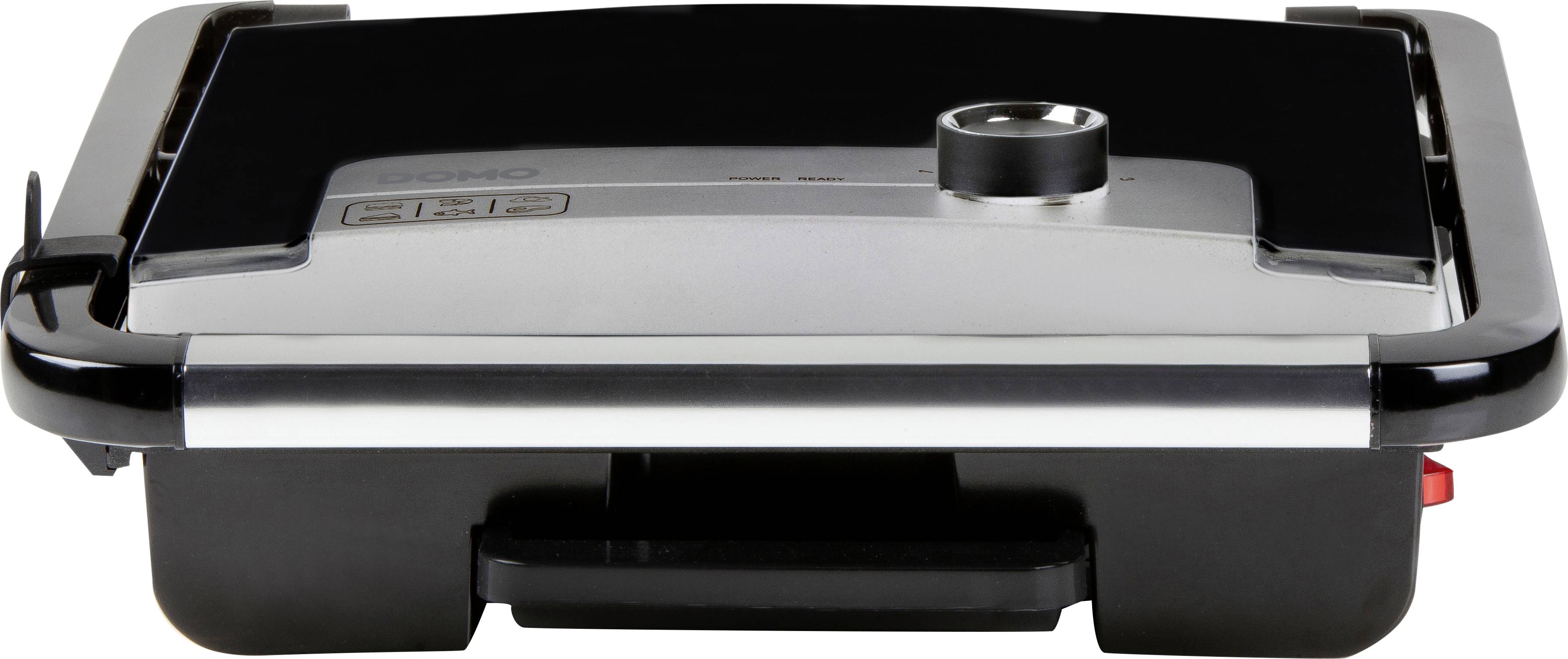 Black electric grill with silver lid, central temperature control and side indicator lights. Ideal for indoor grilling.