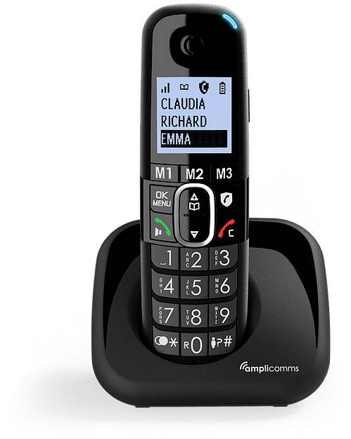 Cordless telephone with large, illuminated buttons, display showing names: 'CLAUDIA', 'RICHARD', 'EMMA'. In charging station.