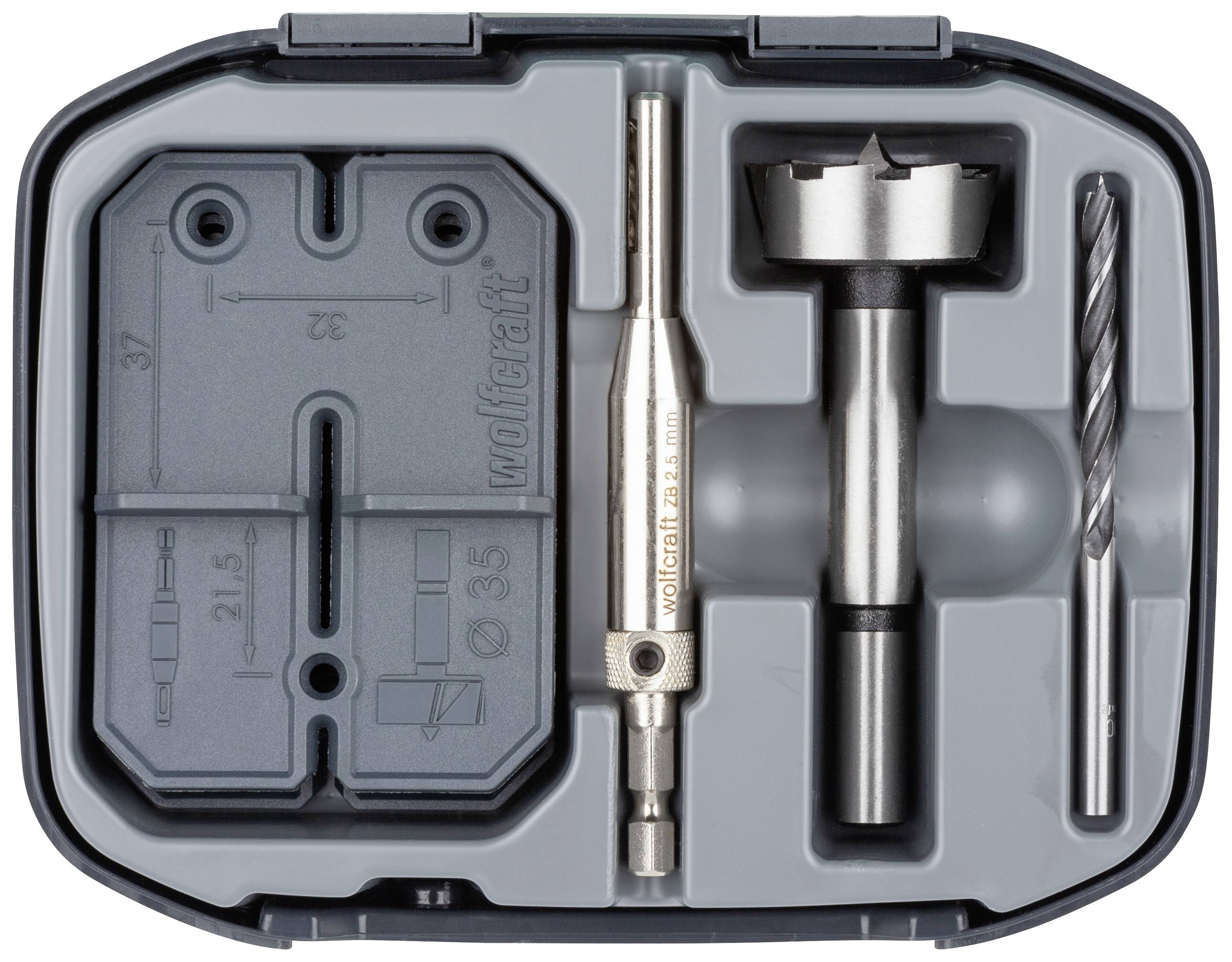 Drill crown set in a plastic case. Contains a drill bit, hole saw and accessories, arranged in a moulded insert.