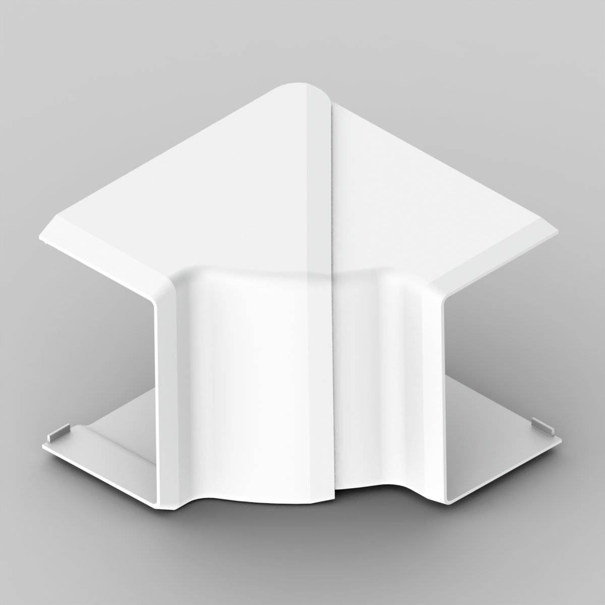 White 3D-printed object with a geometric design, resembling a stylised arrow or roof. It stands upright on a grey surface.