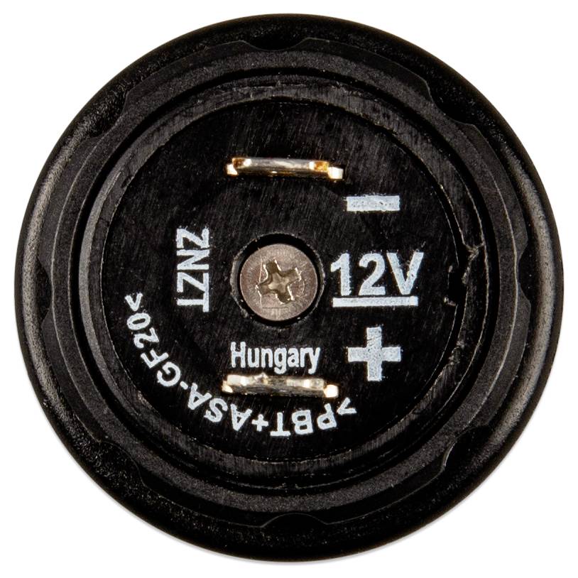 Close-up of a black circular power socket labeled '12V', with positive and negative symbols and the word 'Hungary'.