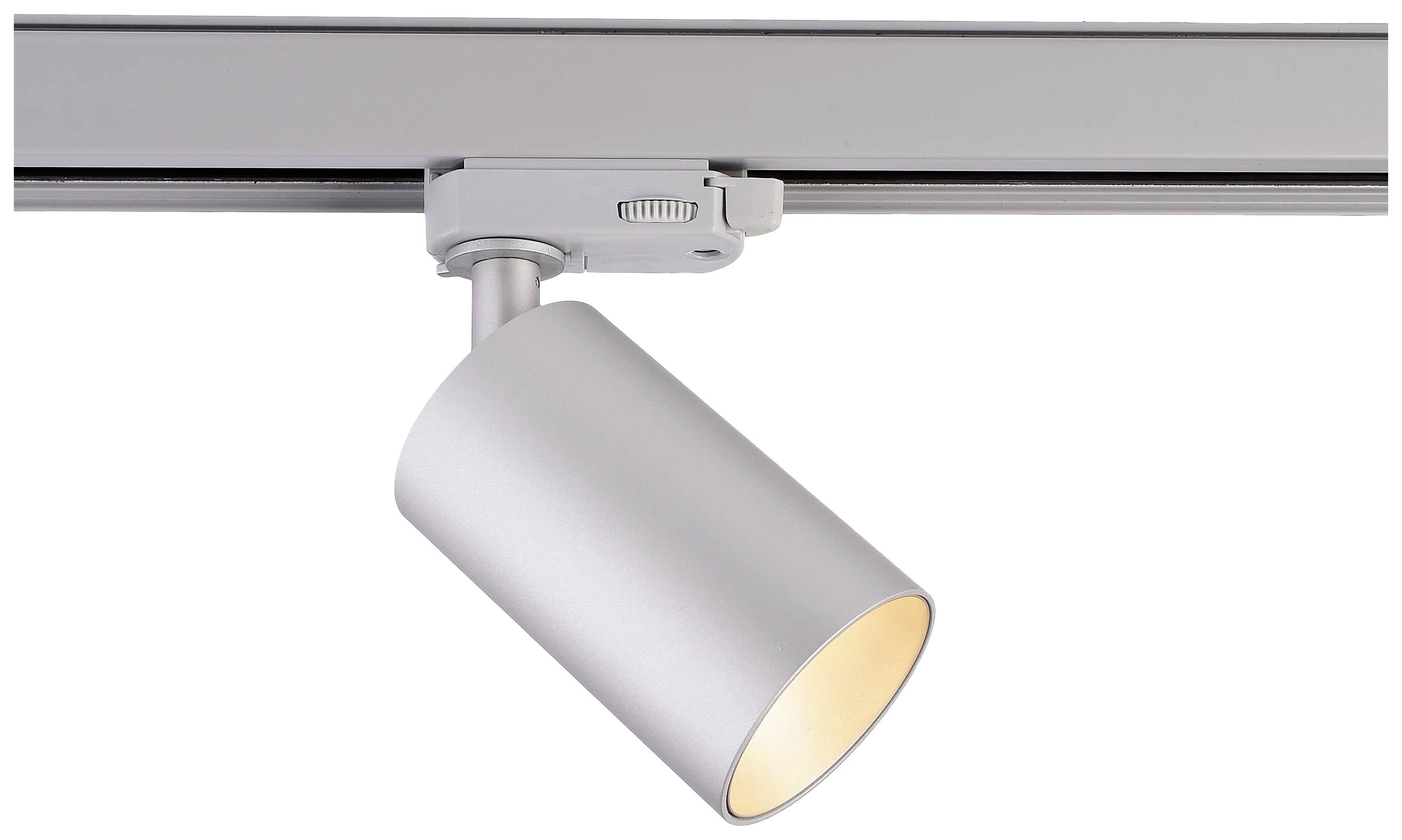 Silver track light with a cylindrical housing, mounted on a ceiling, emitting warm light.