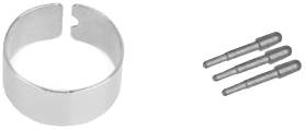 A metal ring beside three metal pins on a white background.