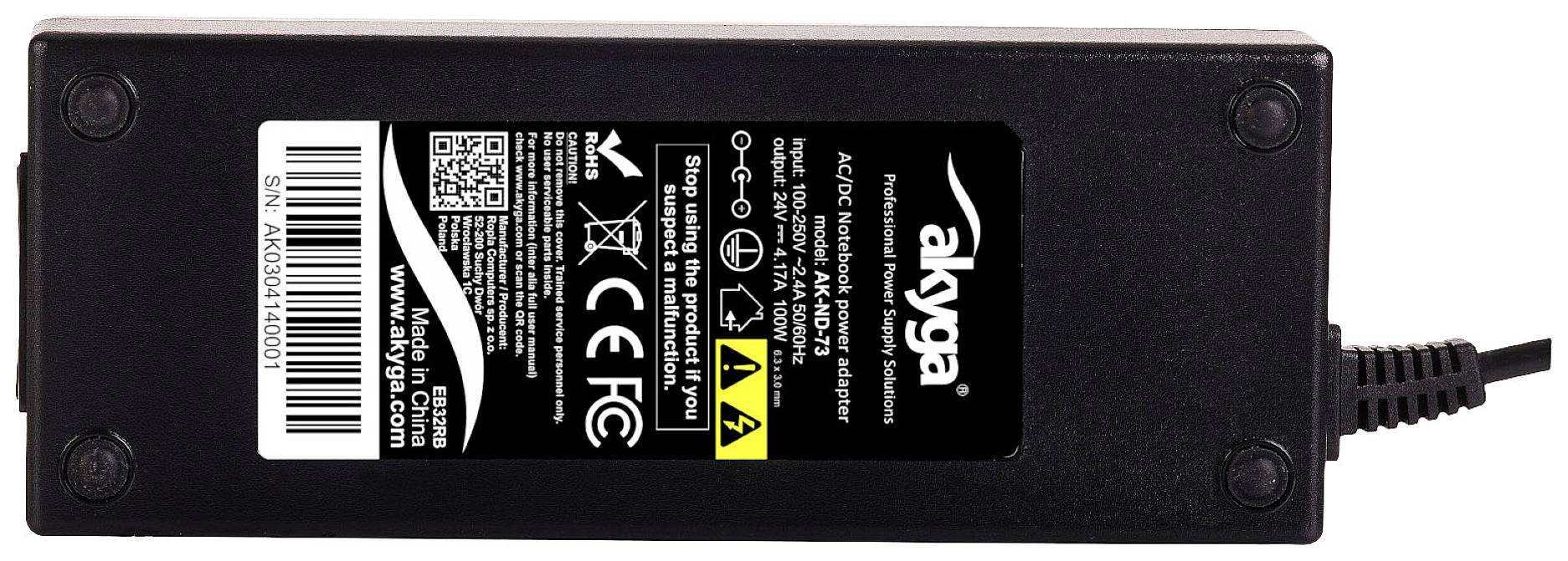 Black power supply by Akyga with technical specifications and safety symbols on the label, including CE and FCC marks.