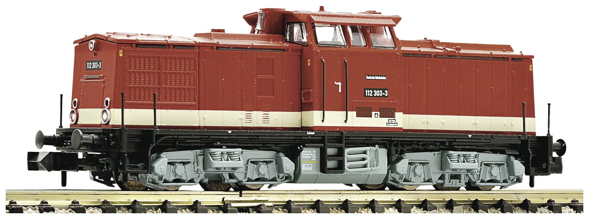 Red model of a diesel locomotive, labelled '118 050-4', on a section of track, side view.