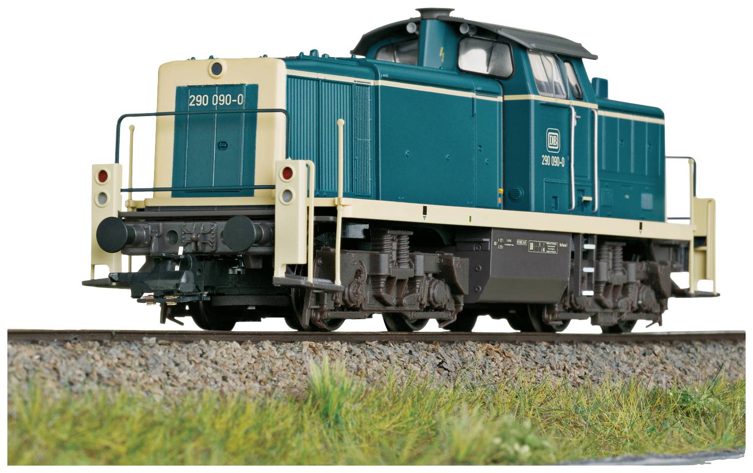 A blue-green model locomotive of series 290 stands on a track. It shows fine details and is precisely designed.