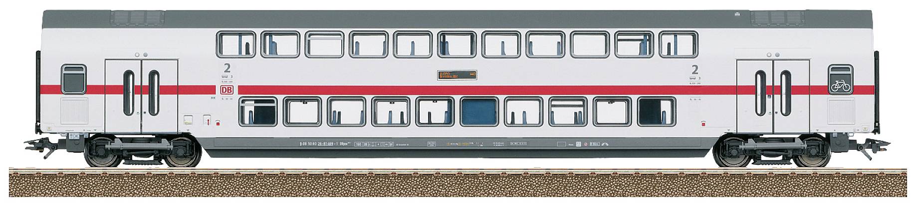 Double-decker passenger train of the railway, side view, with red stripes and multiple windows, standing on a section of track.