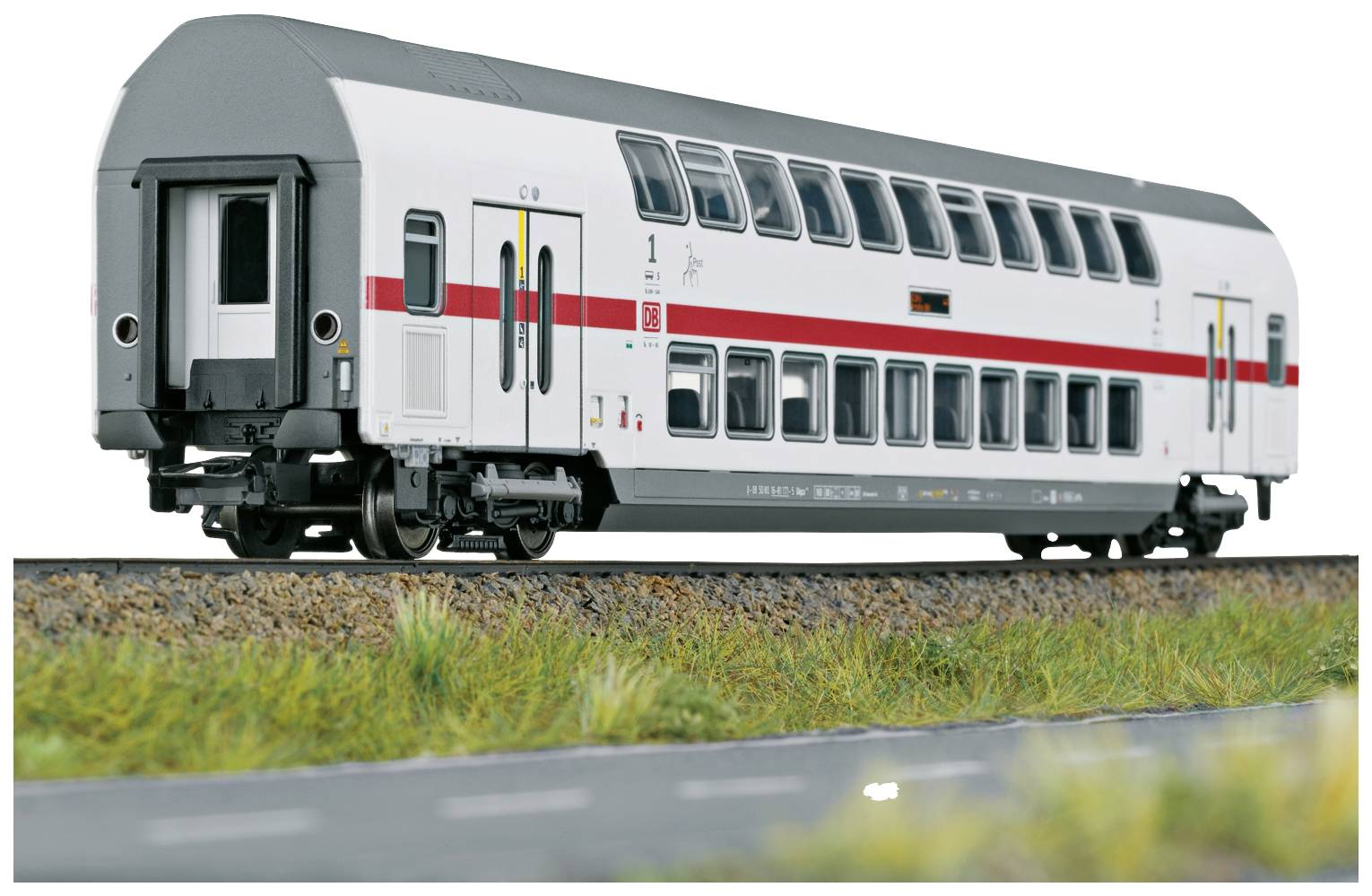 A two-storey, white model train with a red stripe is travelling on a track. There is no surrounding environment or other trains visible.