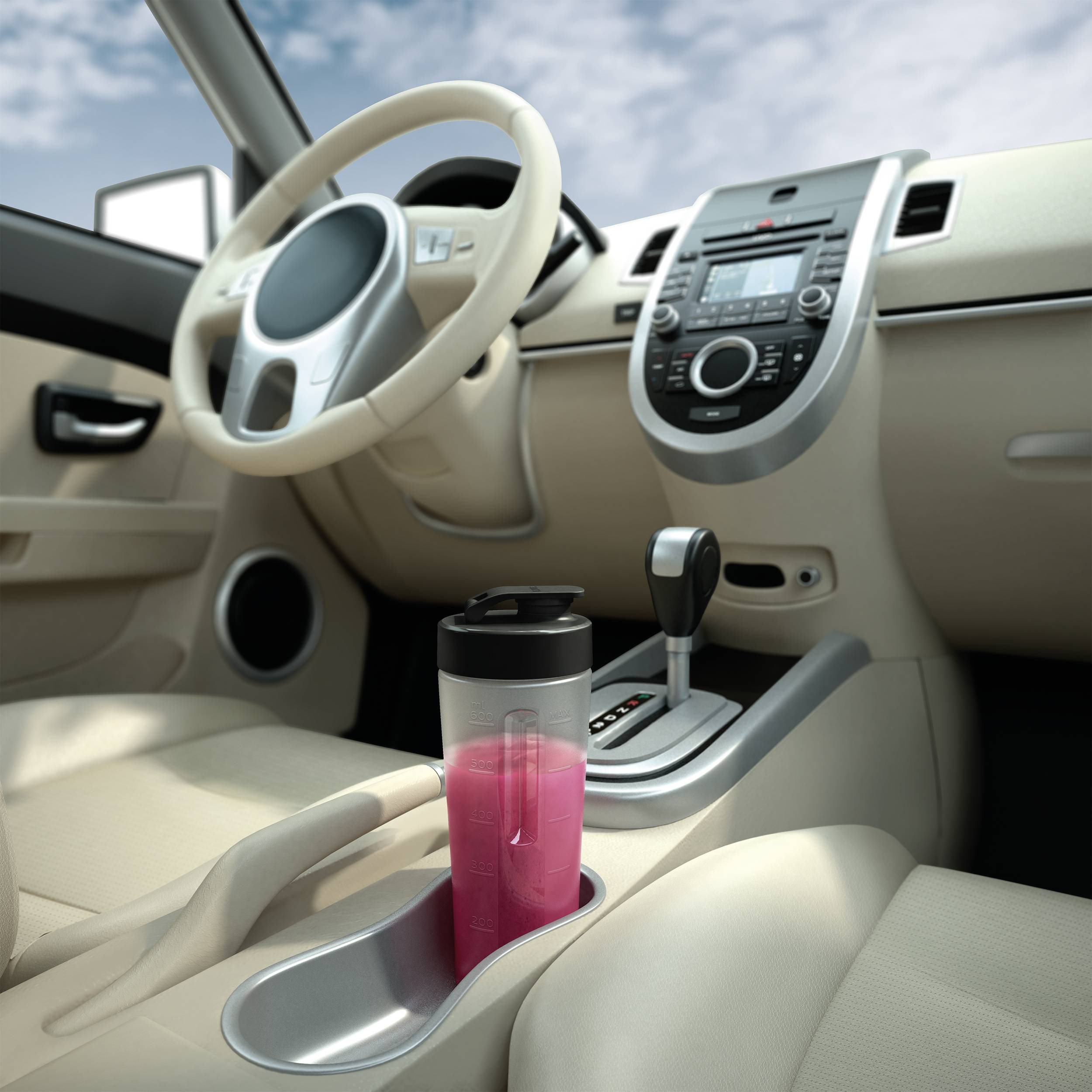 Interior of a car with a centrally positioned drinks holder. A pink cup is placed inside it. Automatic transmission visible.