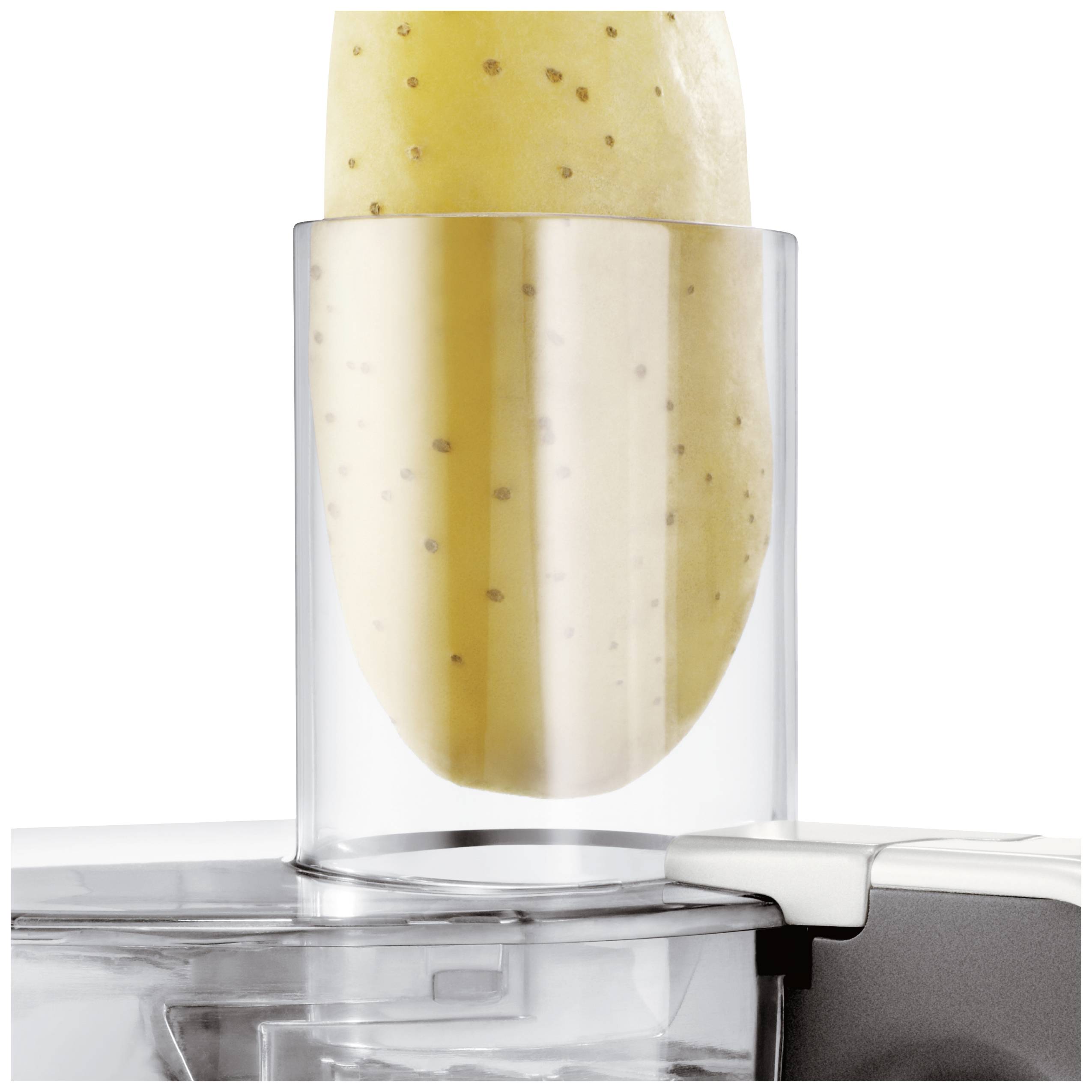 A potato is placed in a transparent container of a kitchen appliance, ready to be peeled or chopped.