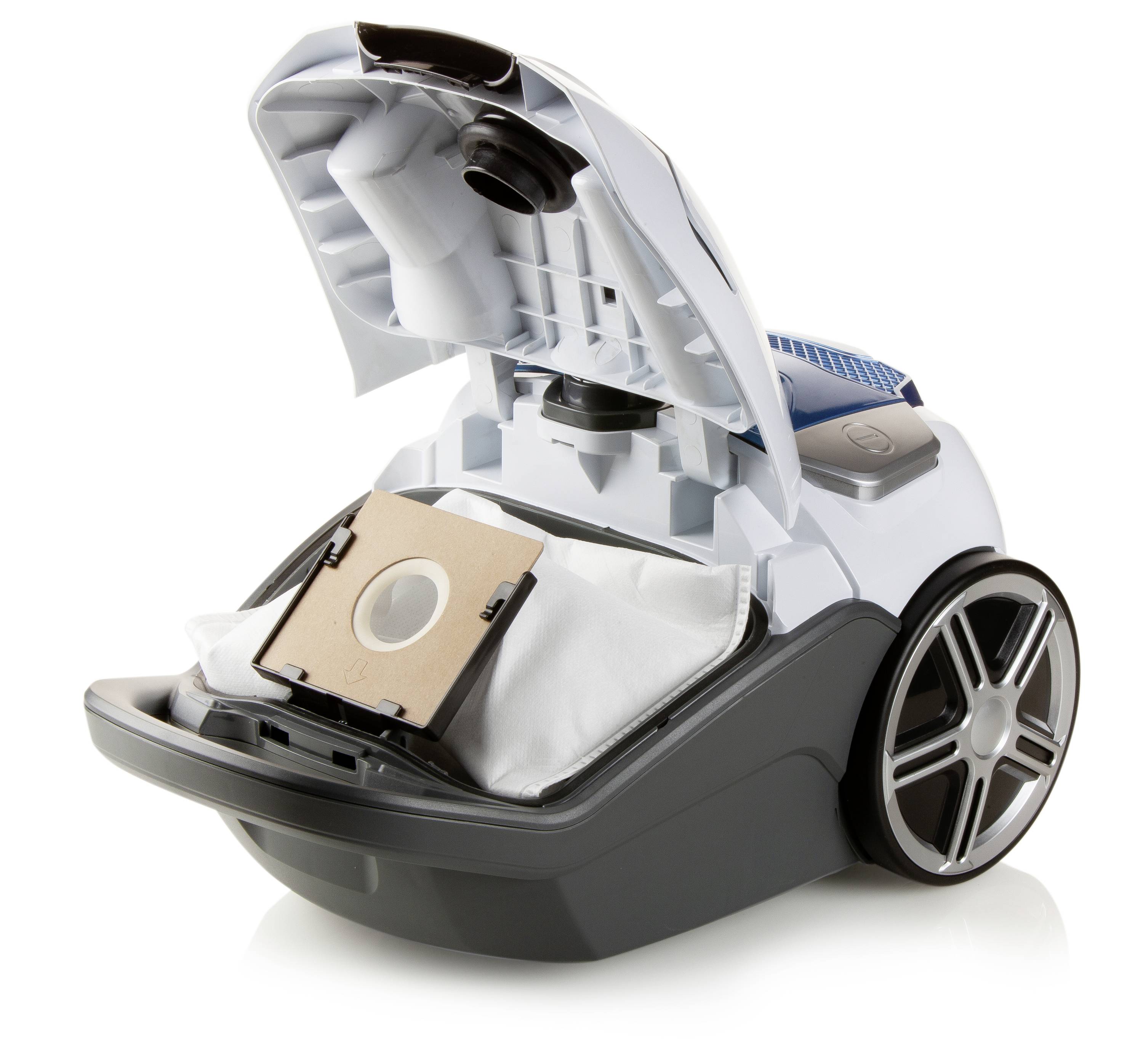 A vacuum cleaner with an open flap shows a bag replacement. The bag and the interior of the vacuum cleaner are visible.