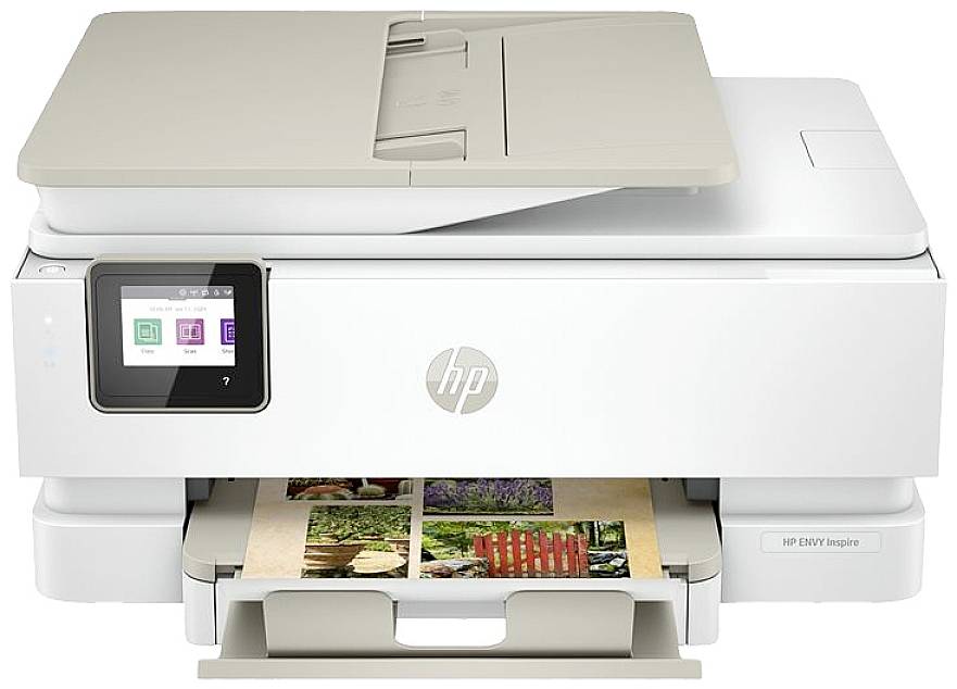 Multifunction printer with a screen and an open paper tray, printing a colour photograph.