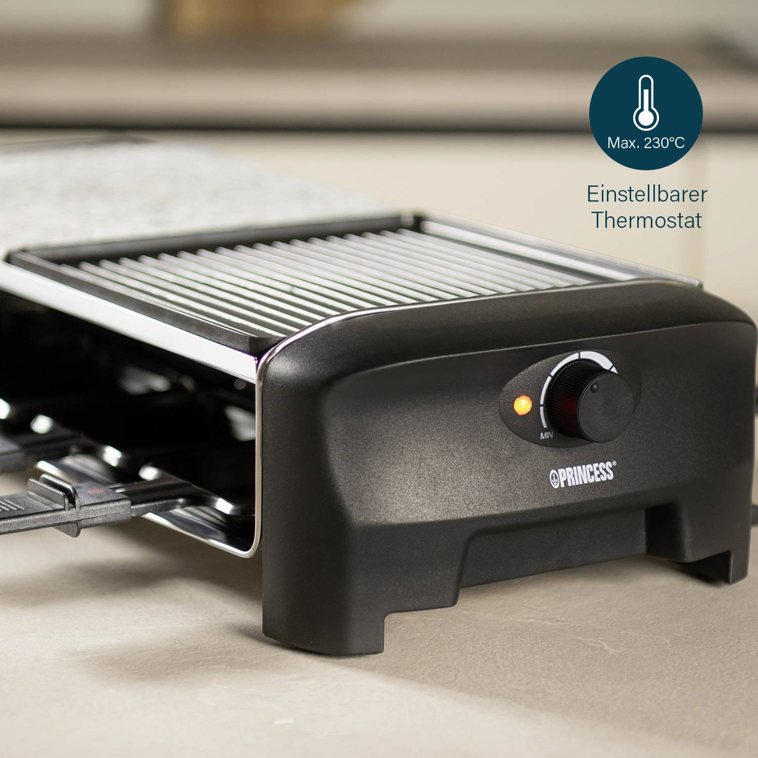 Grill appliance with adjustable thermostat, maximum 230°C. The rotary knob indicates temperature control. Suitable for tabletop use.