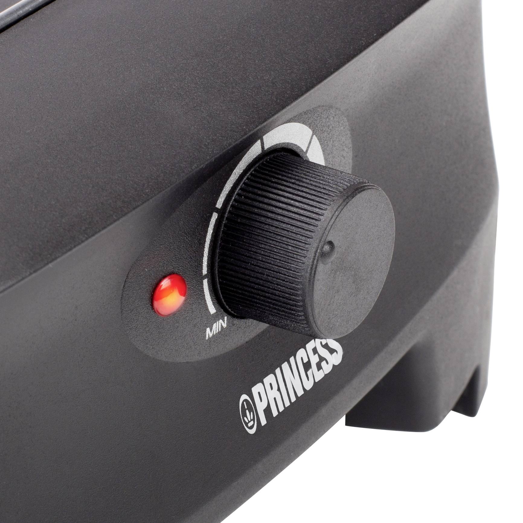 Close-up of a black kitchen oven with a rotary dial for temperature control and a red indicator light, brand 'Princess'.