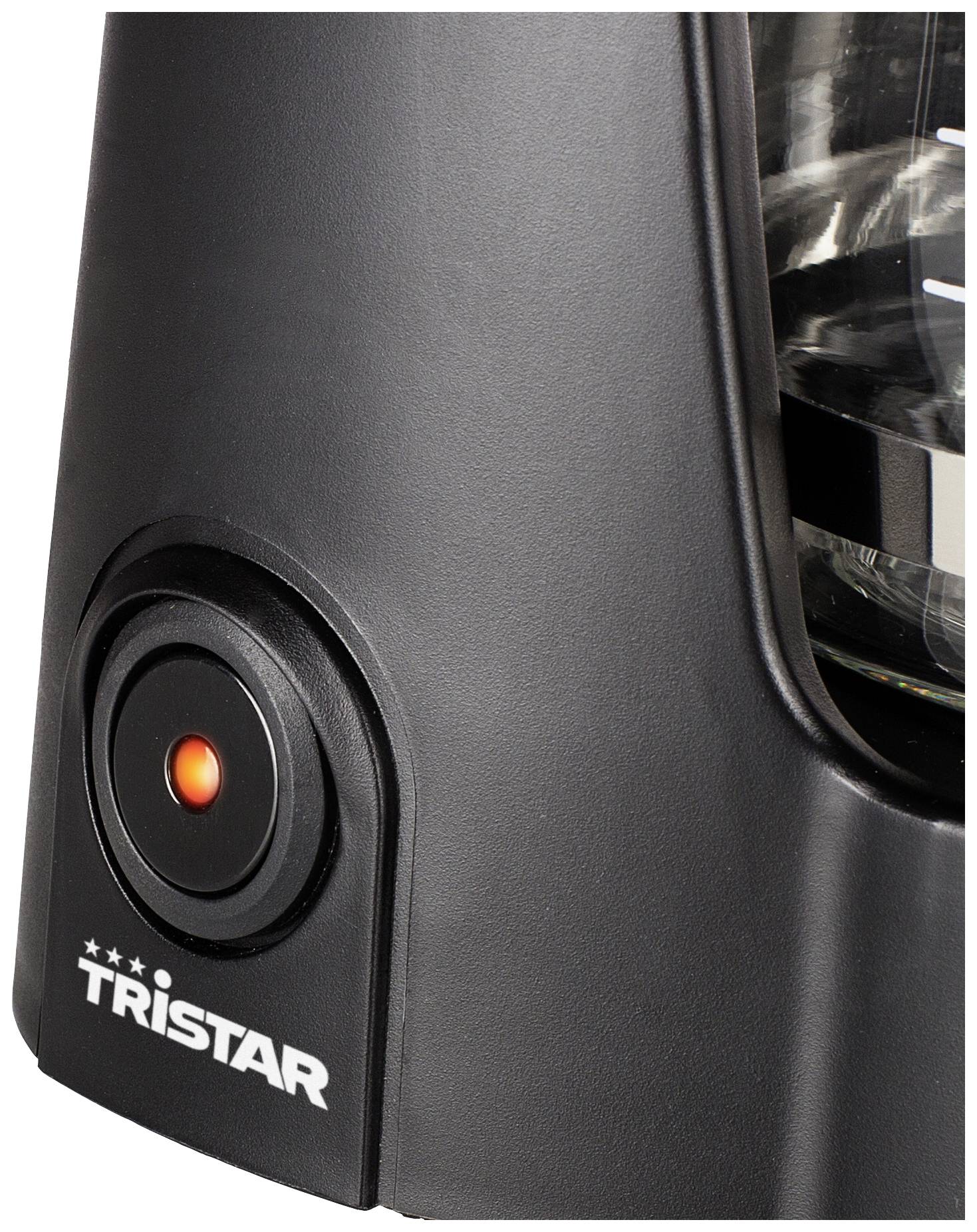 Coffee machine with black casing, illuminated power button and jug with water level indicator.