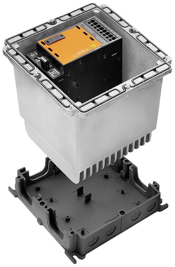 An open metal box reveals an orange and black electrical control unit inside, with the bottom of the box removed.