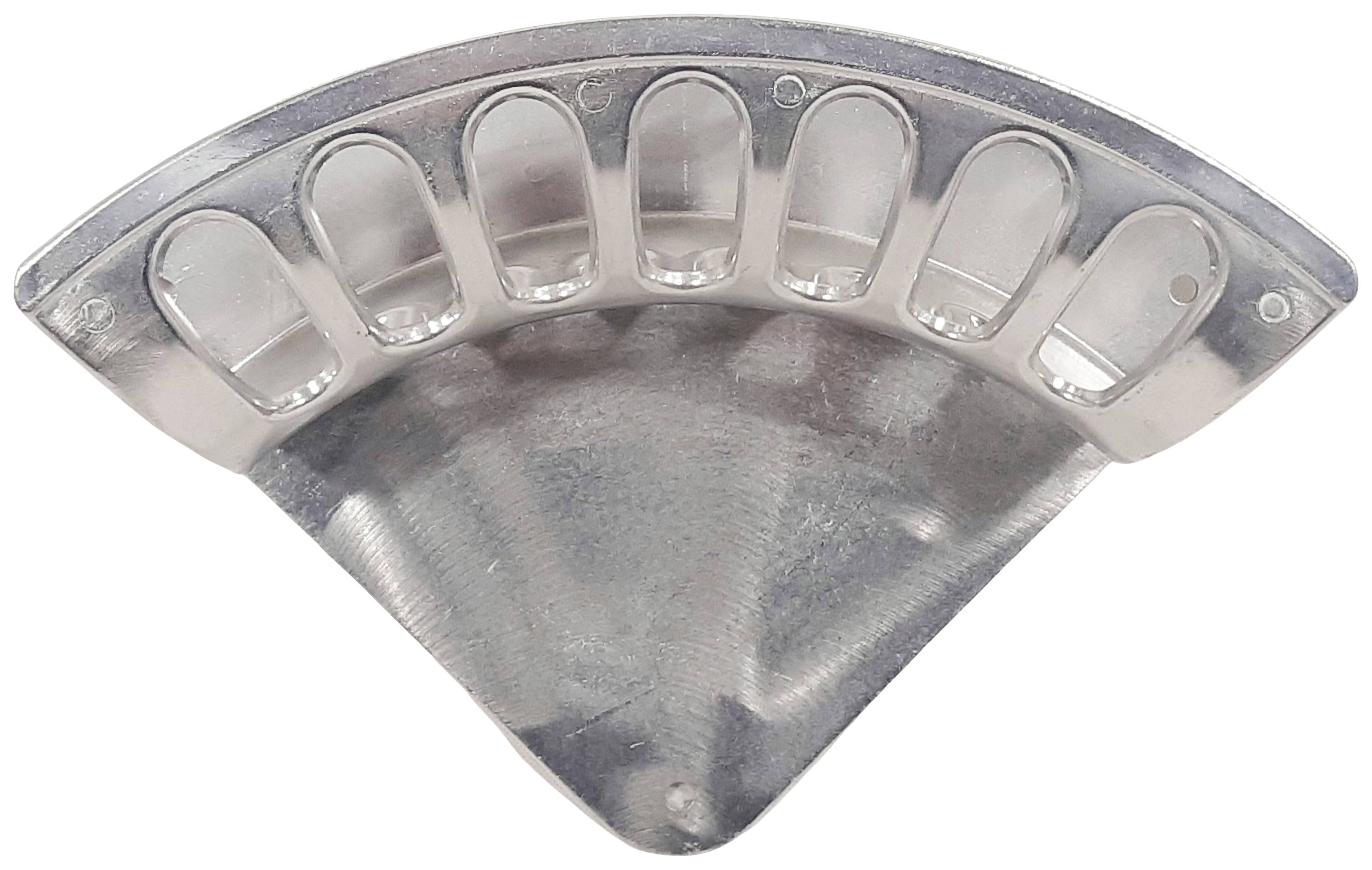 A dental impression tray made of metal, semi-circular with indentations for teeth. Used for taking dental impressions.