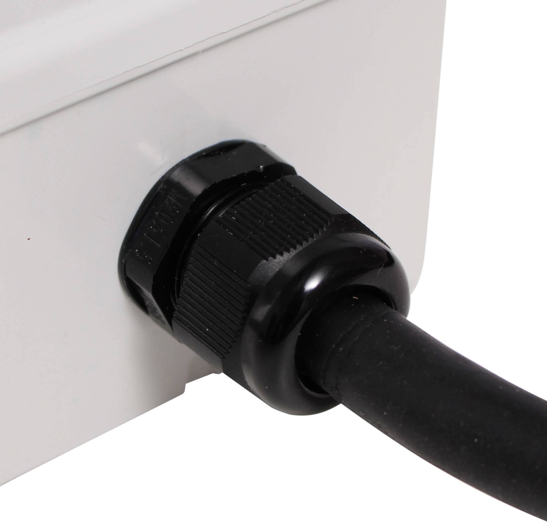 Close-up of a black cable being routed through a cable gland into a white housing.