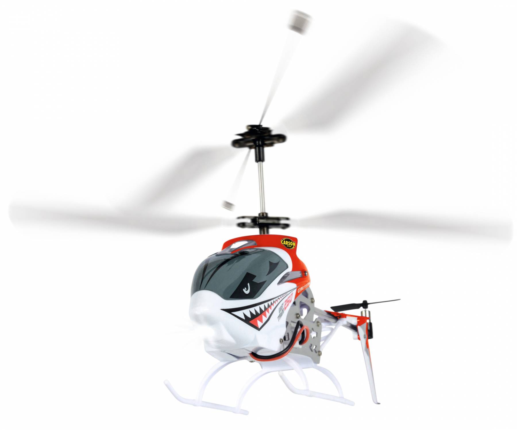 A toy helicopter with a shark-like face and red and white paintwork flies, with rotating rotor blades visible.