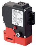 A black and red electrical device with visible connections and technical information on a label.