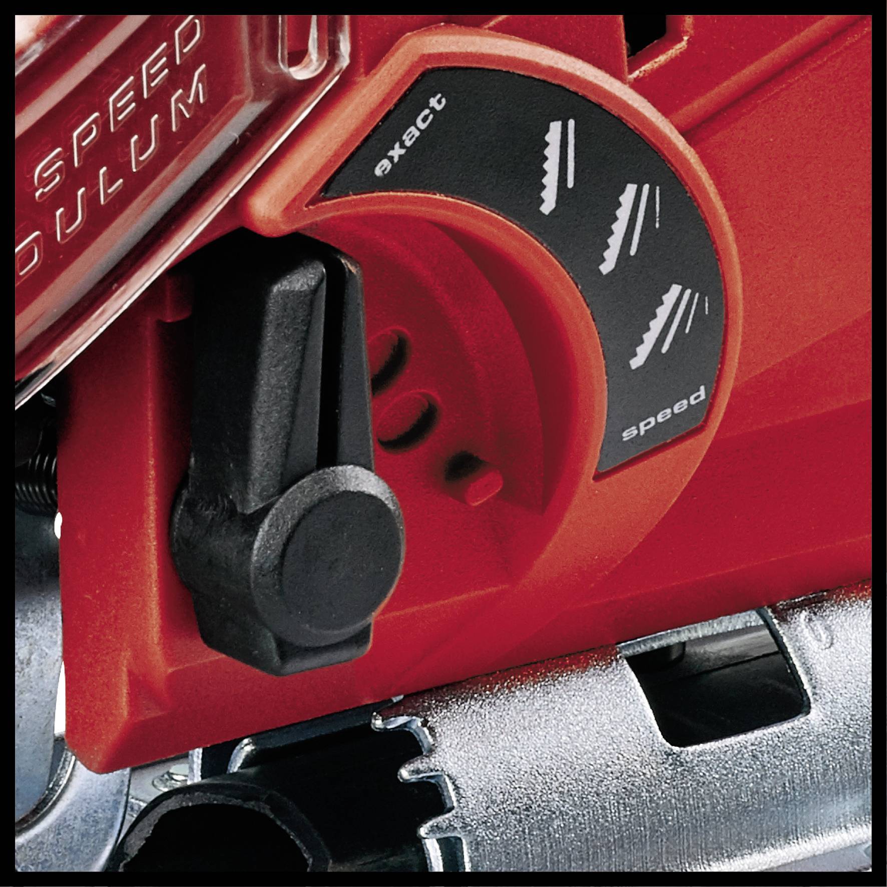 Close-up of a red electric jigsaw with a switch for adjusting cutting speed and blade movement.