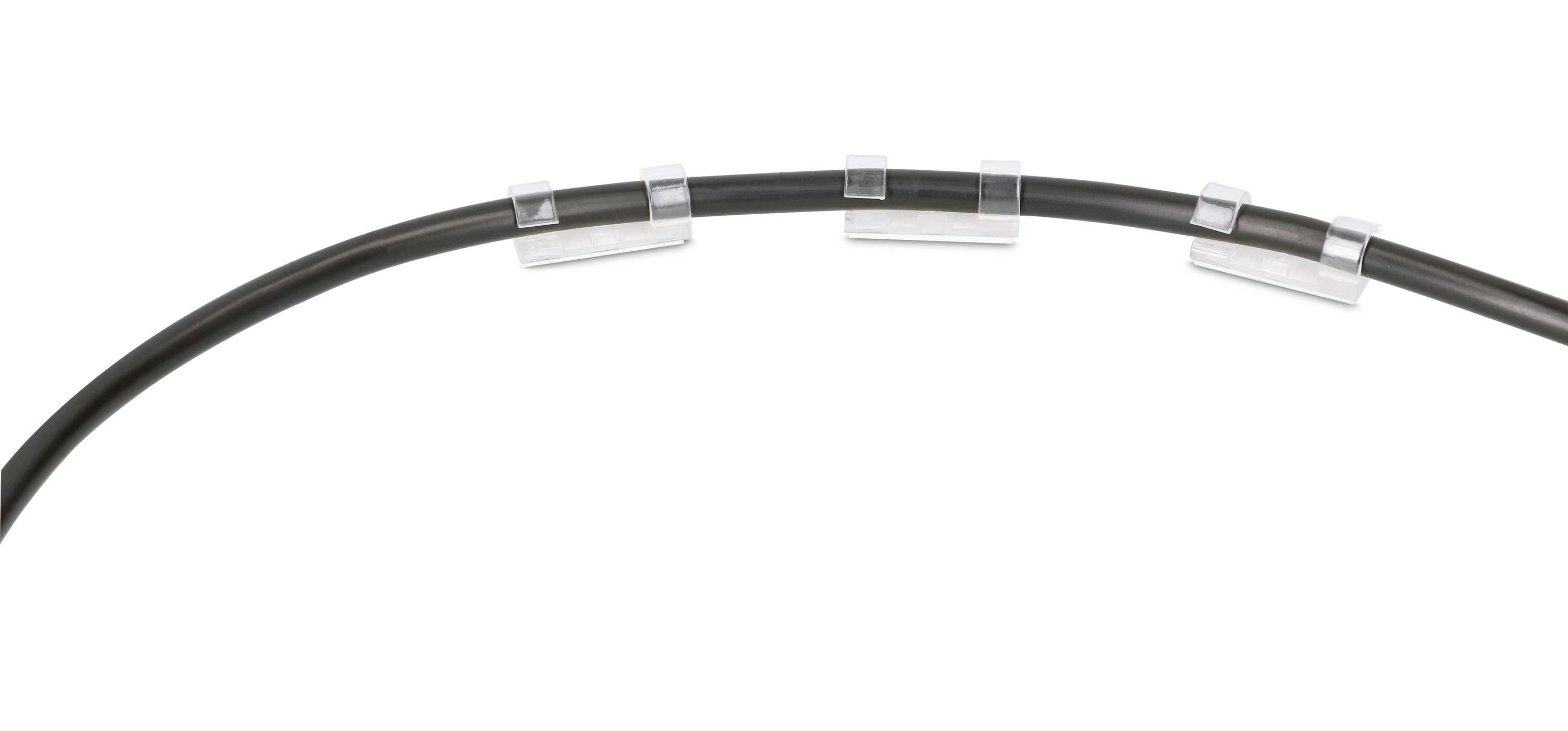 A black cable is held by five transparent cable clips, evenly distributed across a curved surface.