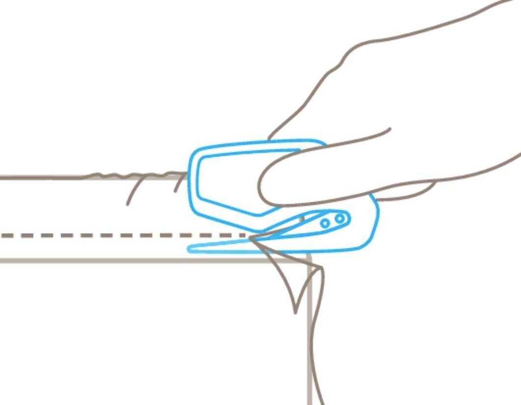 A hand cutting along a dotted line with a safety knife to open packaging material.