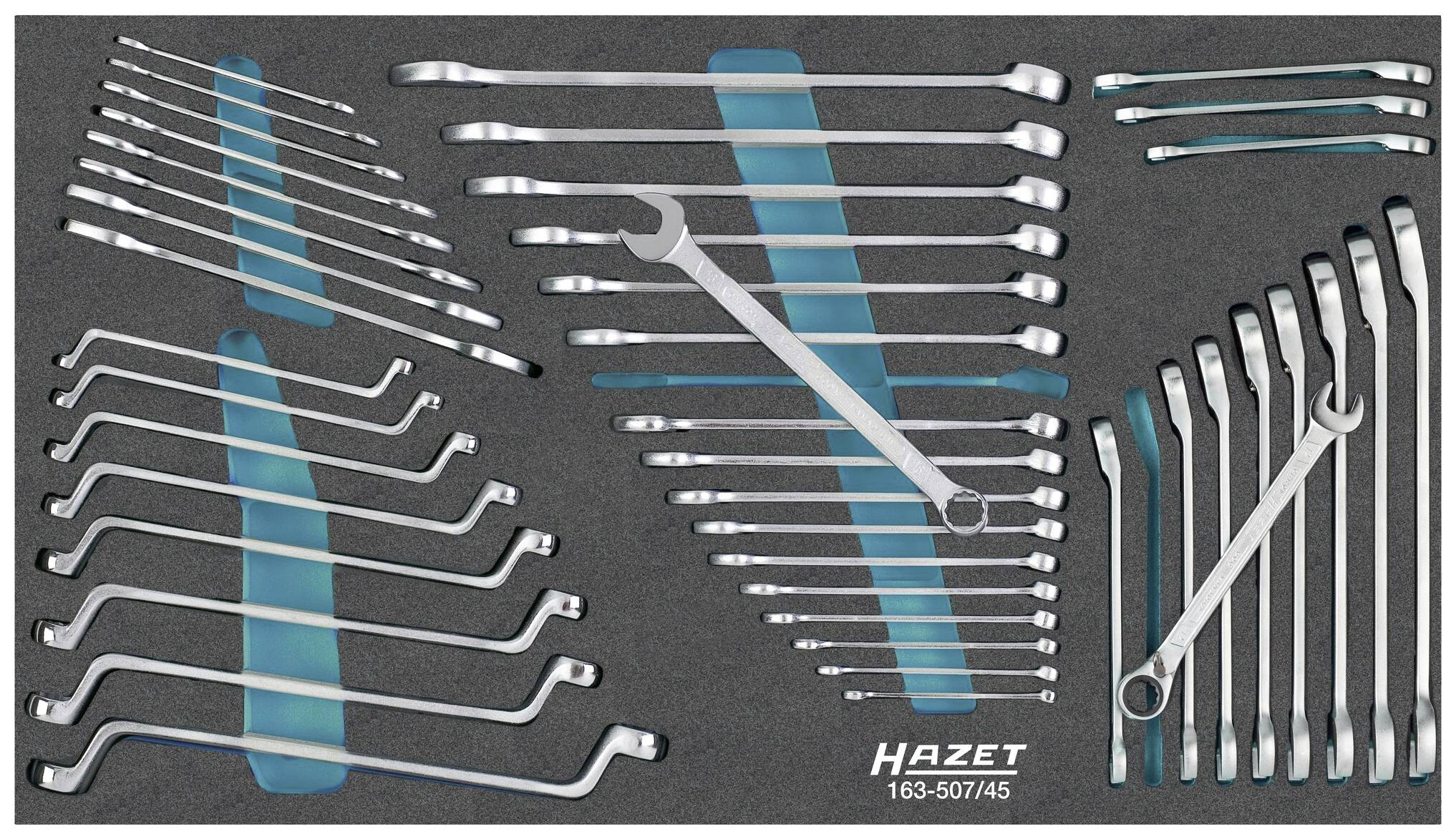 A set of curved and double-ended spanners in various sizes, neatly arranged in a foam insert.