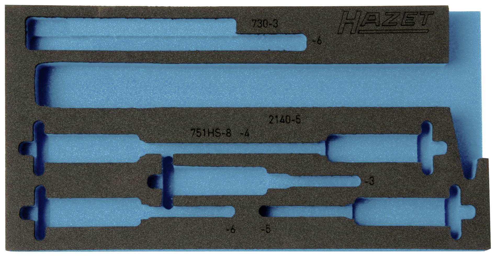 Foam insert with precisely cut recesses for five screwdrivers, partially labelled, against a blue background.