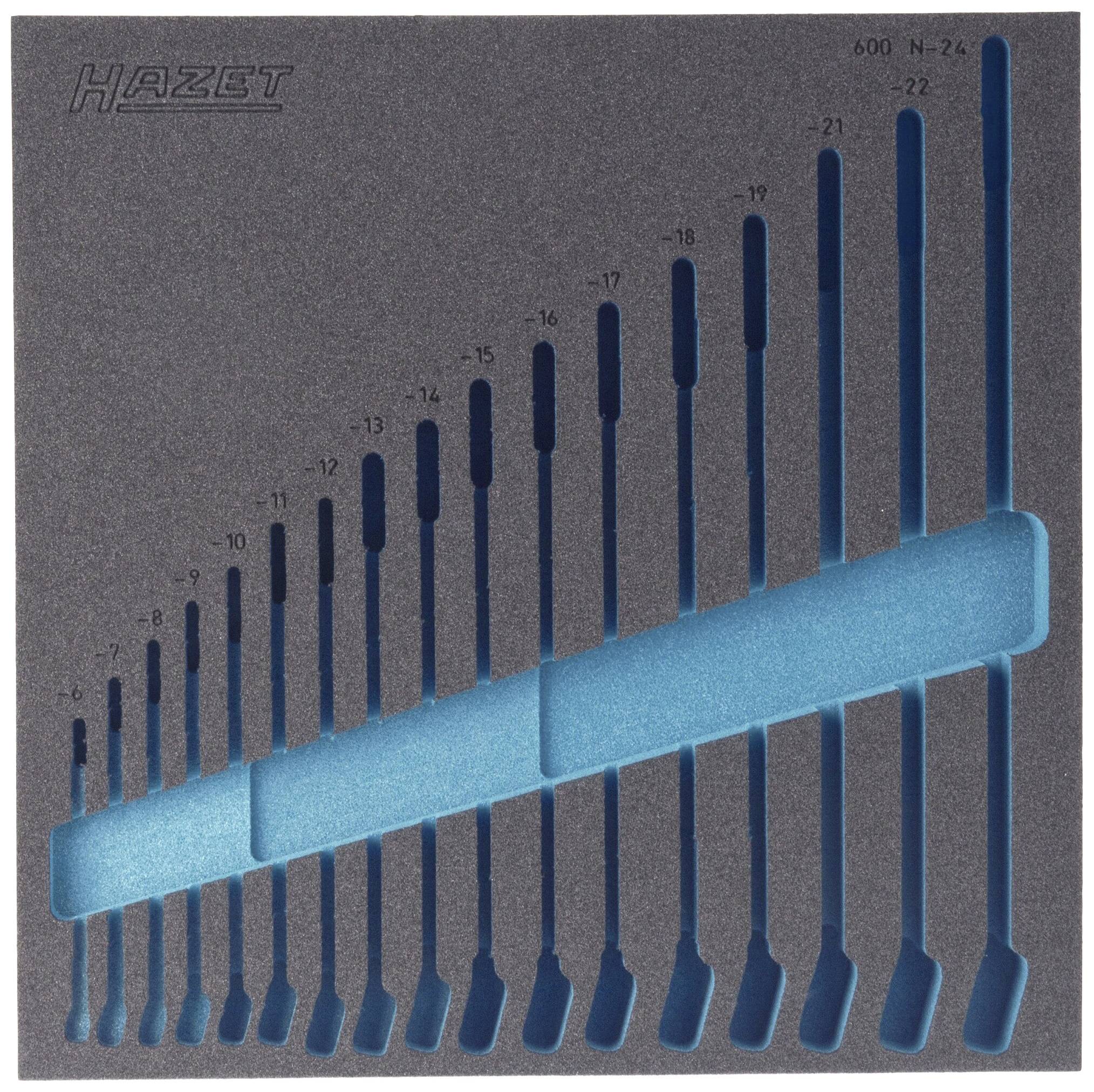 Foam insert with recesses for 24 spanners in various sizes, from 6 to 32 mm, arranged at an angle.