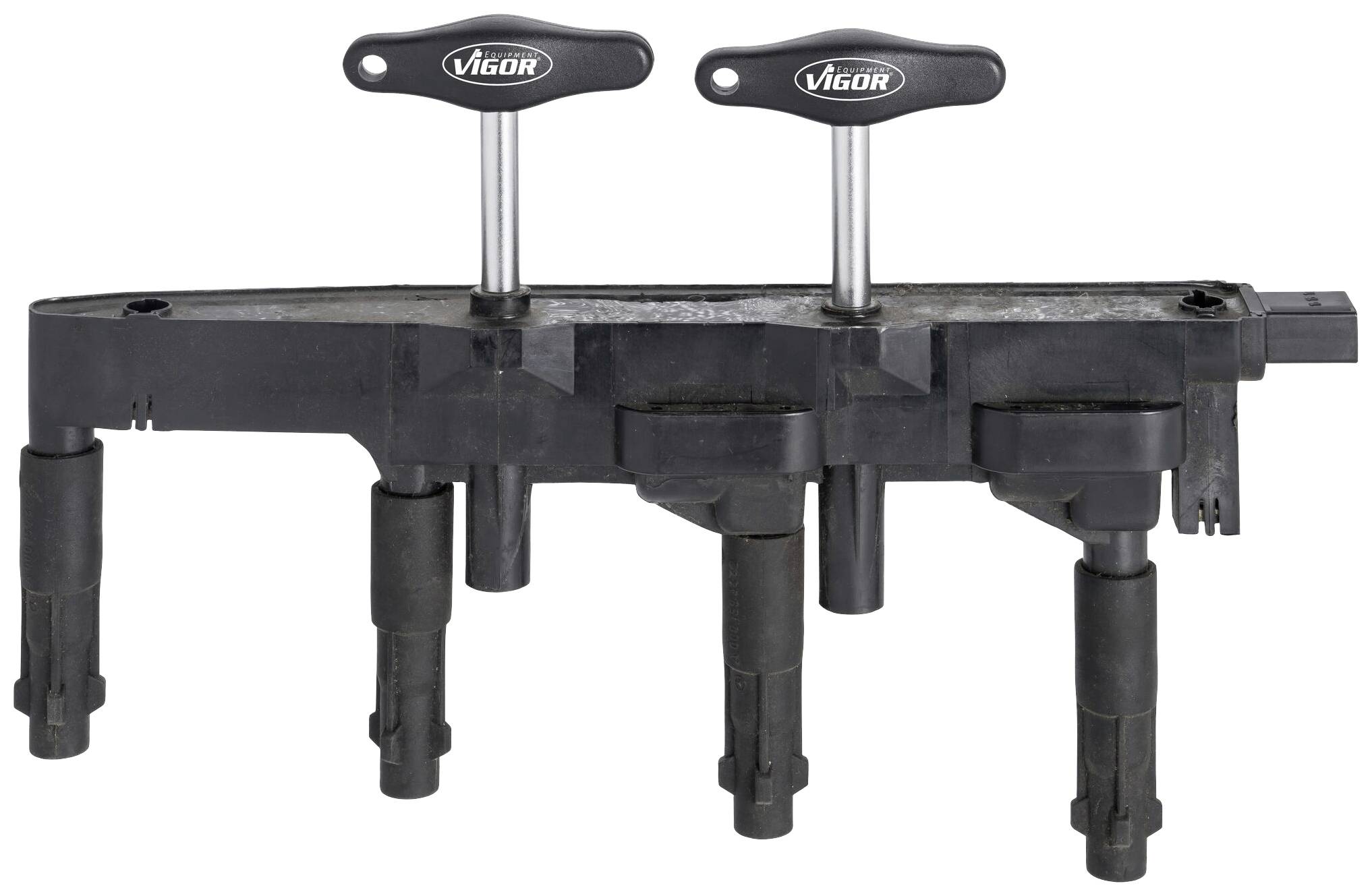 A black motor valve adjustment tool with four pins and two handles, marked with 'Vigor', for tuning motor valves.