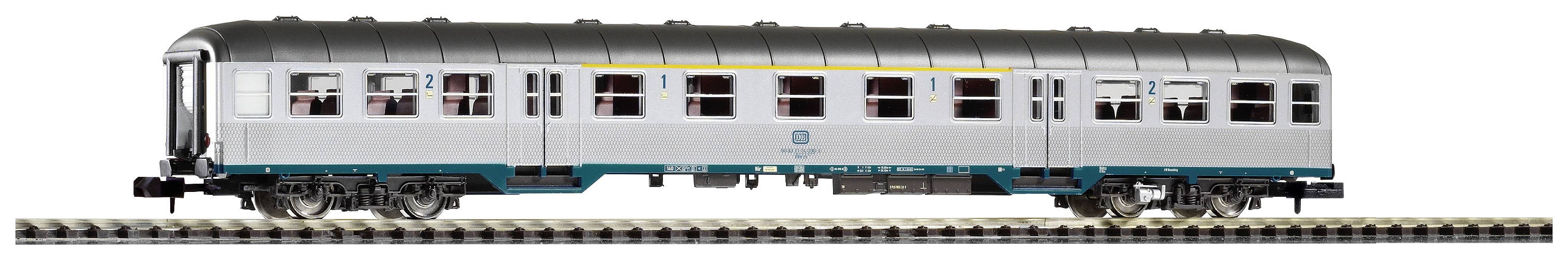 A model train carriage sits on a railway track. It is silver with a yellow stripe near the roof and bears the logo of a railway company.