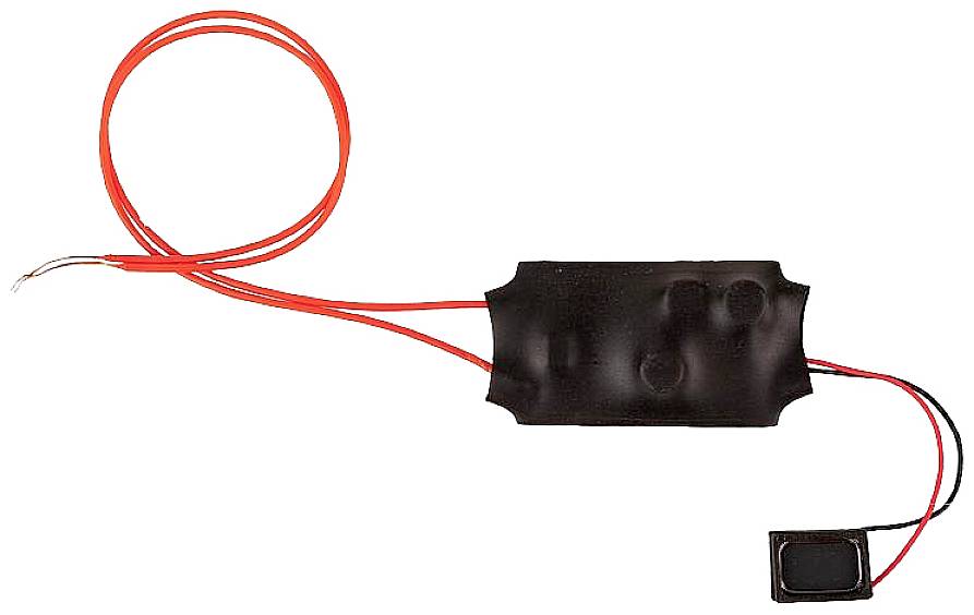 A black electric switch with two red cables and a smaller black component.