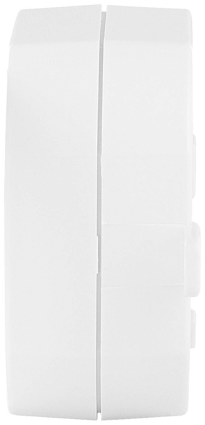 A white electronic device to the side, smooth and rectangular, with a small indentation in the centre.