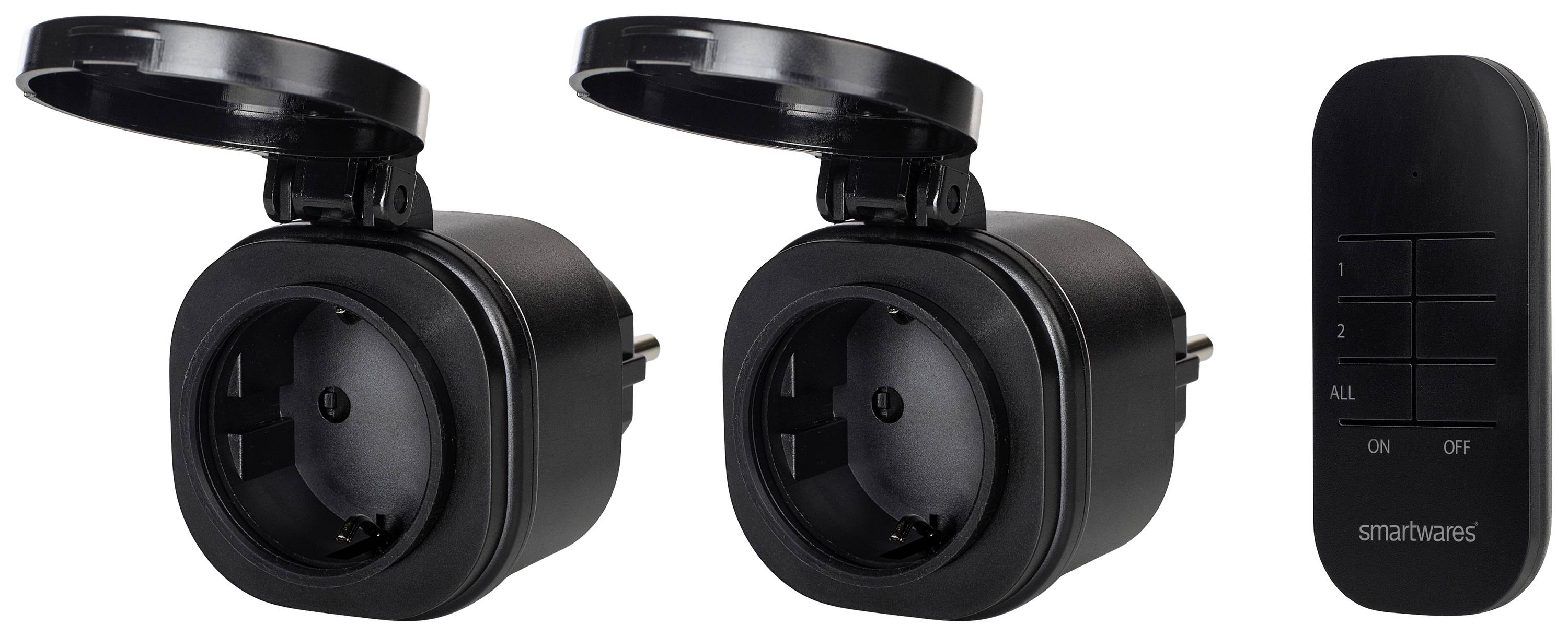 Two black smart plug sockets with protective covers and a remote control with buttons for control.