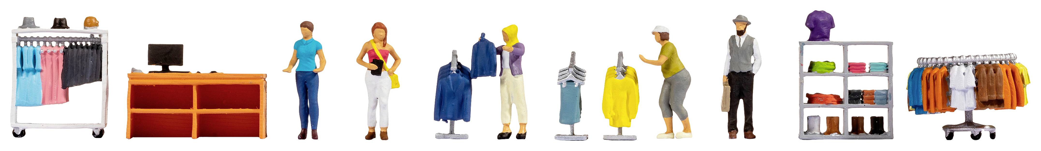 A model of a clothing store displays various mannequins, shelves with clothing and shoes, and a sales counter.