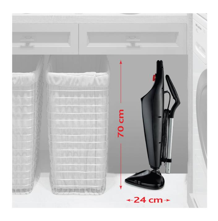 Vacuum cleaner in an upright position: Height 70 cm, Width 24 cm. Placed next to two laundry baskets under a worktop.