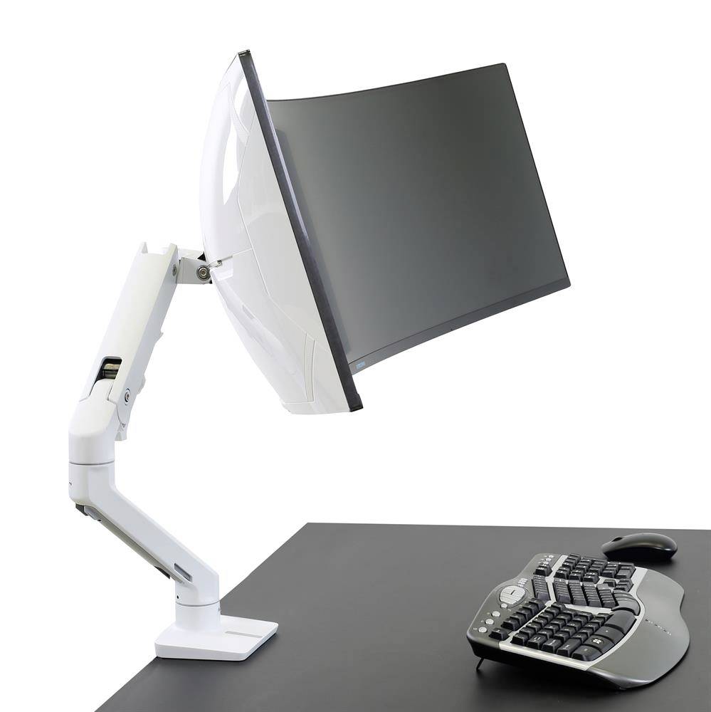 An adjustable monitor mount in a modern office. The monitor is mounted on a pivoting stand, with an ergonomic keyboard beside it on the desk.