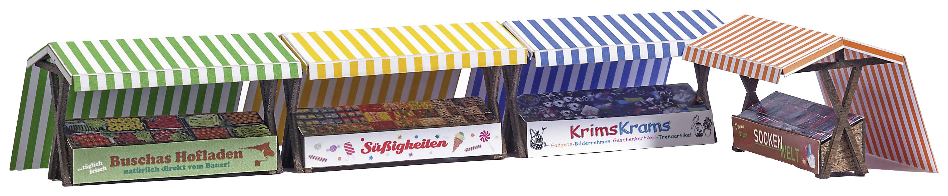 Four colourful market stalls with striped roofs display signs: 'Buche's Farm Shop', 'Sweets', 'Bric-a-Brac' and 'Fruit'.